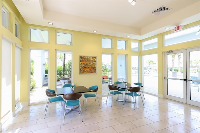 sunroom / solarium featuring french doors and visible vents