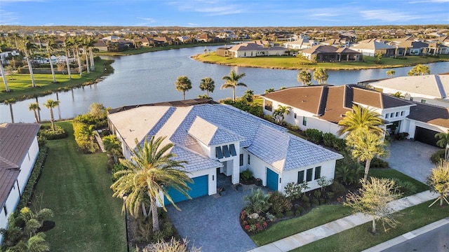 bird's eye view featuring a residential view and a water view