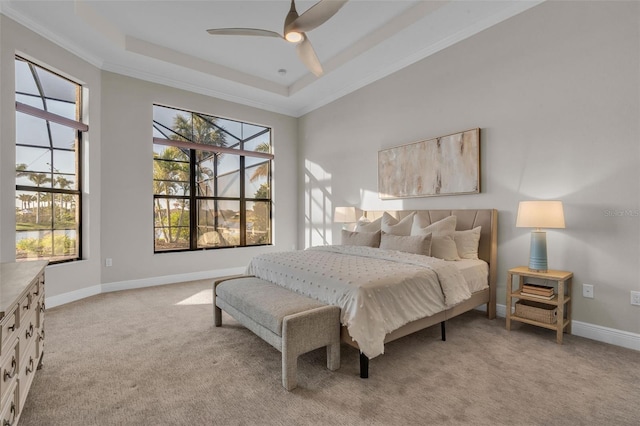 bedroom with light carpet, ornamental molding, and multiple windows