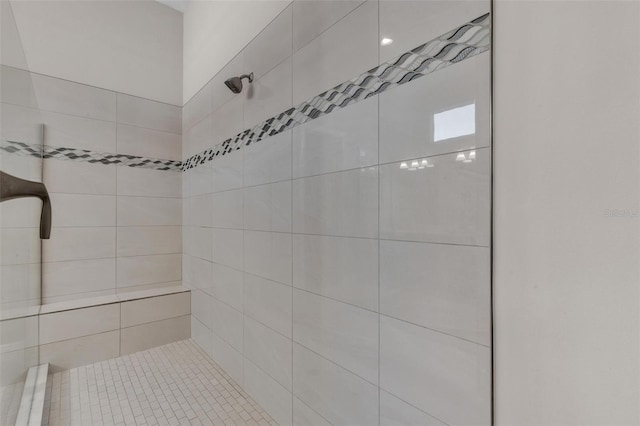 full bathroom featuring a tile shower