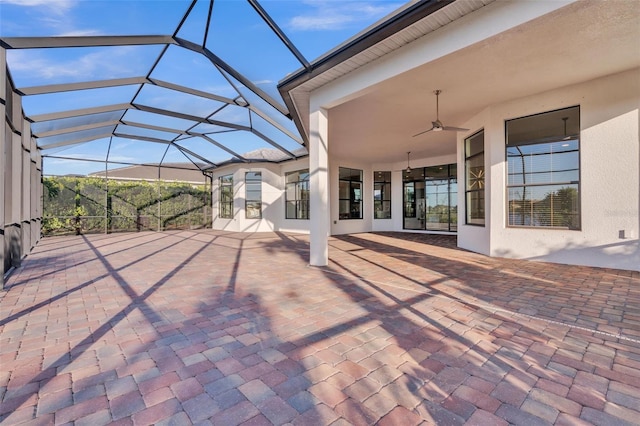 view of patio / terrace featuring a lanai and a ceiling fan