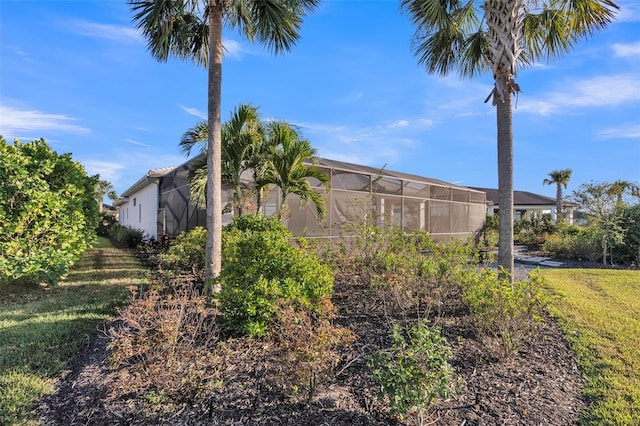view of yard featuring a lanai