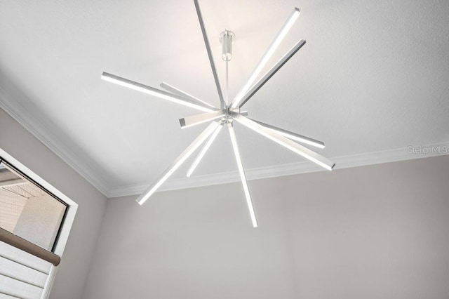 room details featuring ceiling fan and ornamental molding