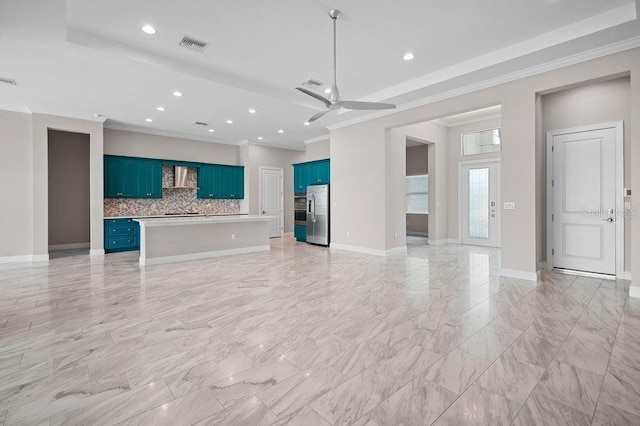 unfurnished living room featuring visible vents, a ceiling fan, baseboards, and ornamental molding