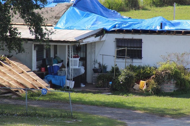 view of side of property with a yard