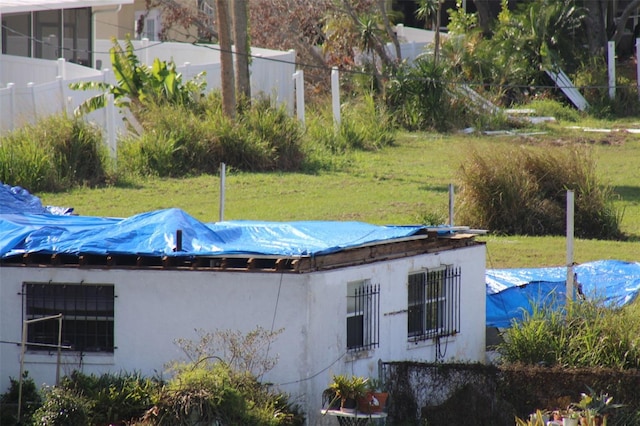 view of pool with a yard