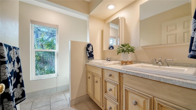 bathroom with tile patterned flooring and vanity