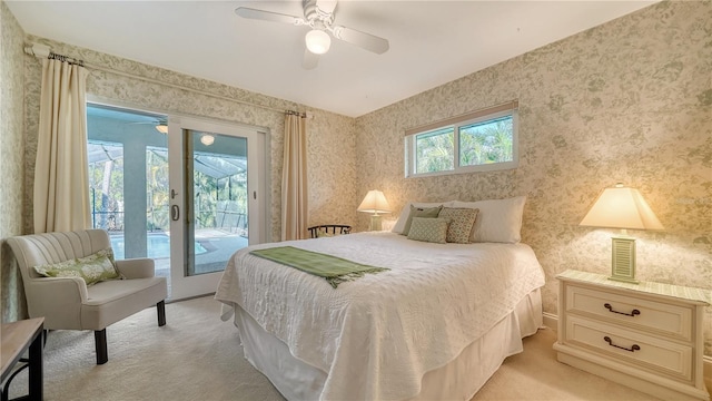 carpeted bedroom with access to outside and ceiling fan