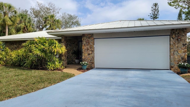 ranch-style home featuring a garage