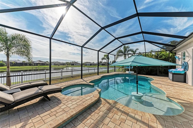 view of pool featuring an in ground hot tub, a patio, a water view, and glass enclosure