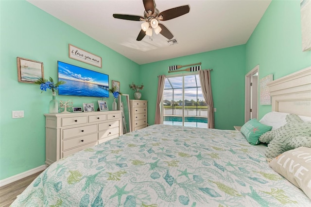 bedroom with ceiling fan and wood-type flooring