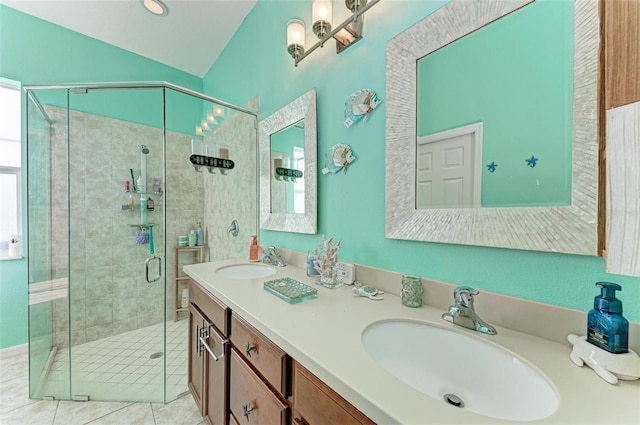 bathroom featuring tile patterned floors, vanity, and a shower with shower door