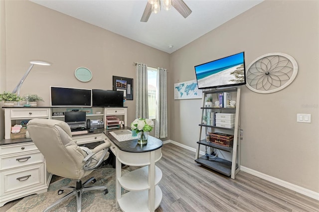 office space featuring ceiling fan, light hardwood / wood-style floors, and lofted ceiling