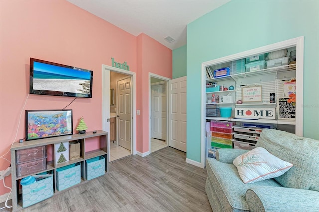 sitting room with light hardwood / wood-style floors