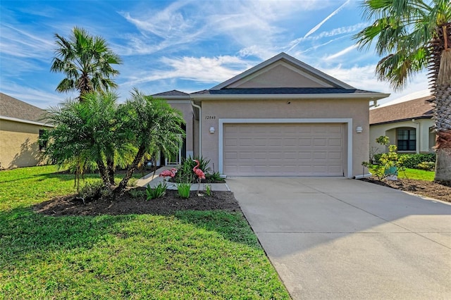 ranch-style home featuring a garage and a front yard