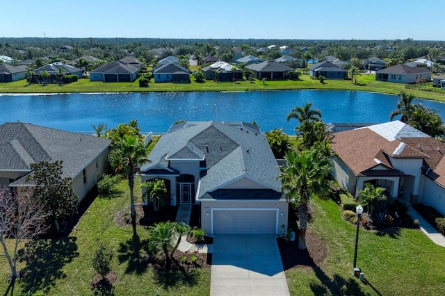 drone / aerial view with a water view