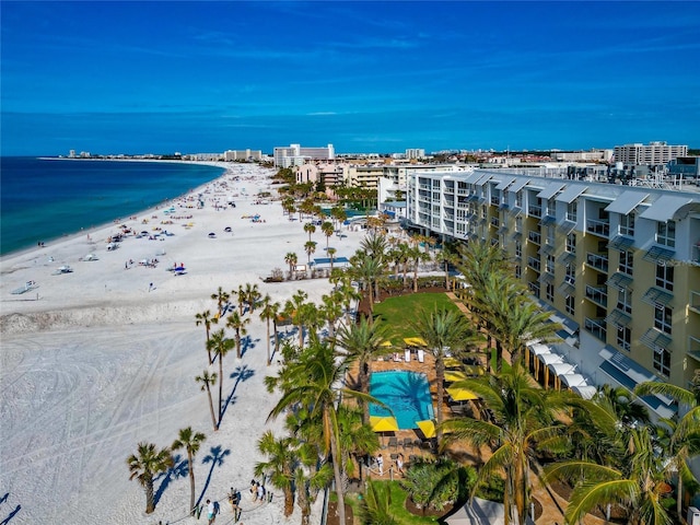 birds eye view of property featuring a water view and a beach view