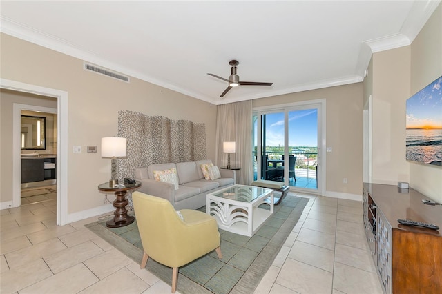 tiled living room with ceiling fan and crown molding