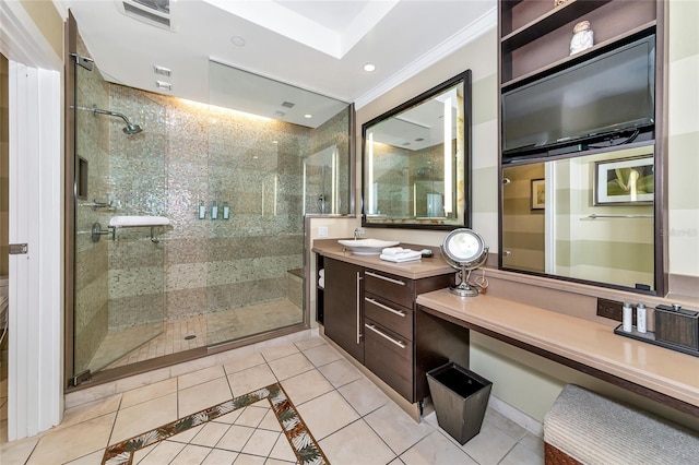 bathroom featuring vanity, tile patterned floors, a shower with door, and crown molding