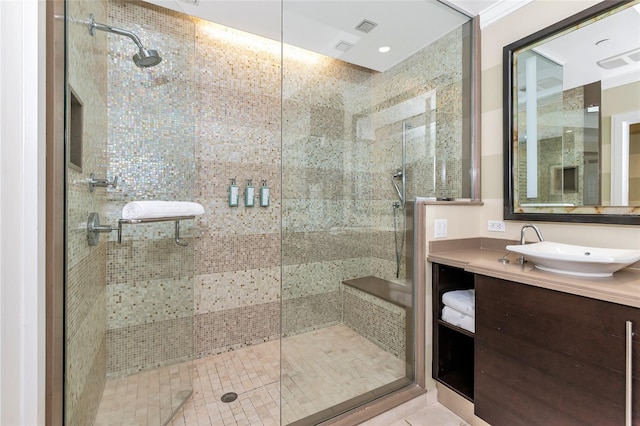 bathroom with vanity and a shower with shower door