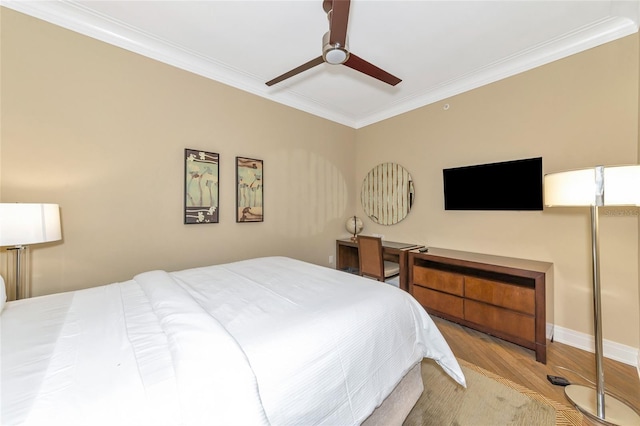 bedroom featuring ceiling fan, light hardwood / wood-style floors, and ornamental molding