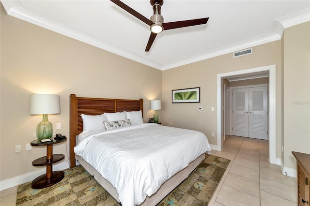 bedroom featuring ceiling fan, light tile patterned flooring, and ornamental molding