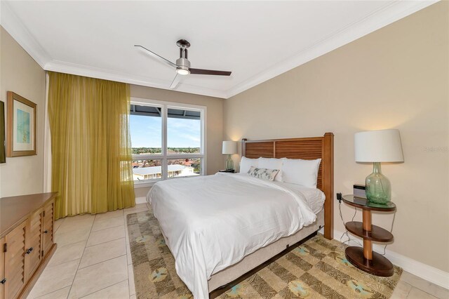 tiled bedroom with ceiling fan and ornamental molding