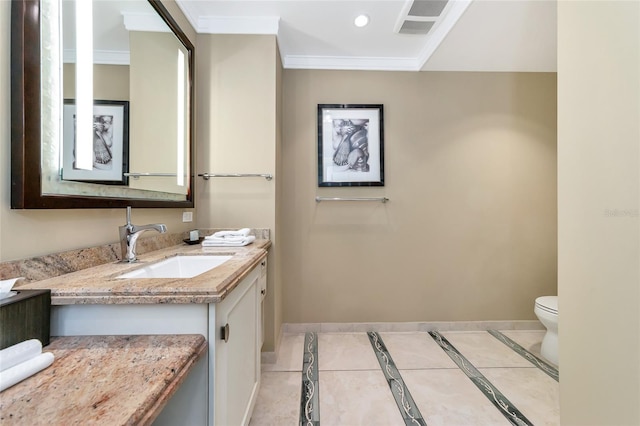 bathroom featuring tile patterned flooring, vanity, toilet, and ornamental molding