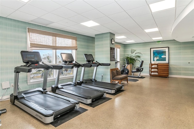 gym with a paneled ceiling