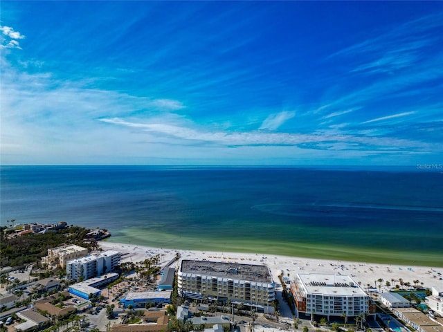 drone / aerial view featuring a beach view and a water view