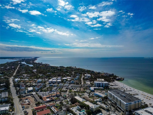 drone / aerial view featuring a beach view and a water view