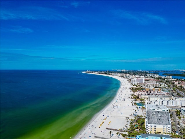 birds eye view of property featuring a view of the beach and a water view