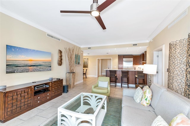 915 Seaside Dr Unit 604, Sarasota, FL 34242 - living room with ceiling fan, ornamental molding, and light tile patterned floors