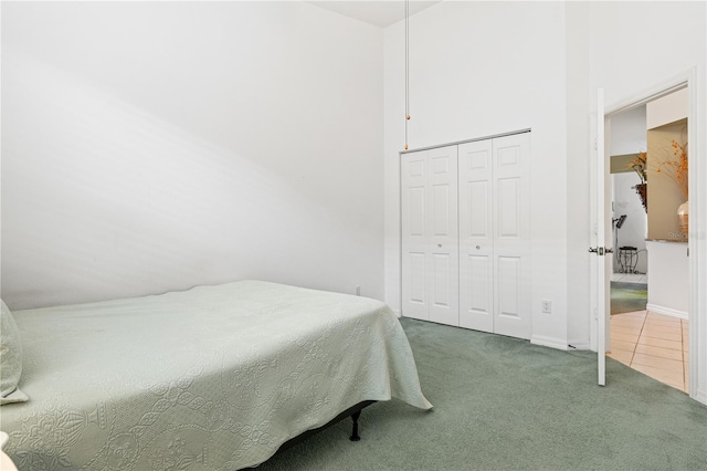 carpeted bedroom featuring a closet