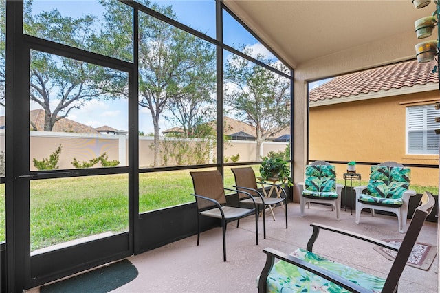 sunroom with vaulted ceiling