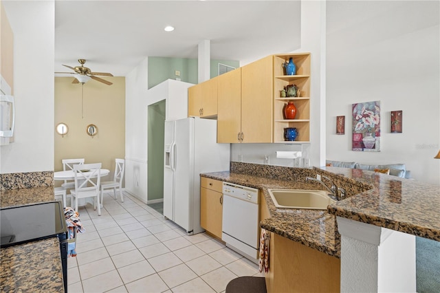 kitchen with ceiling fan, sink, dark stone counters, white appliances, and light tile patterned flooring