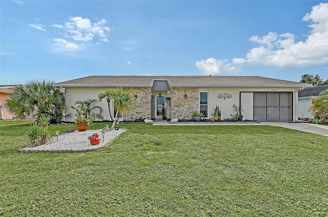 single story home with a front lawn and a garage