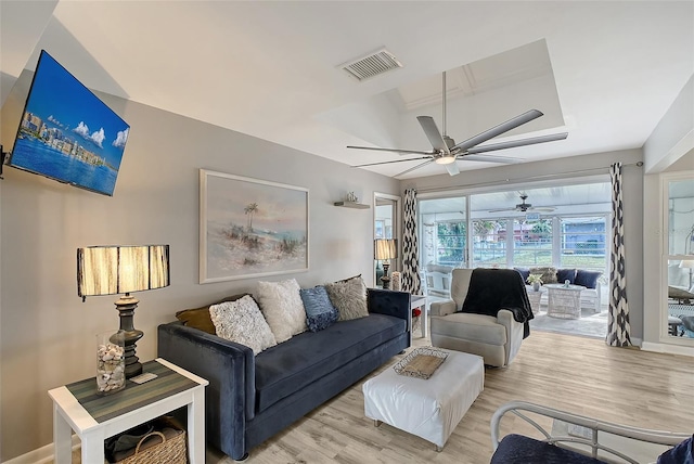 living room with light hardwood / wood-style flooring