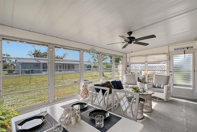 sunroom featuring ceiling fan