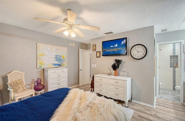 bedroom featuring ceiling fan, a textured ceiling, and light wood-type flooring