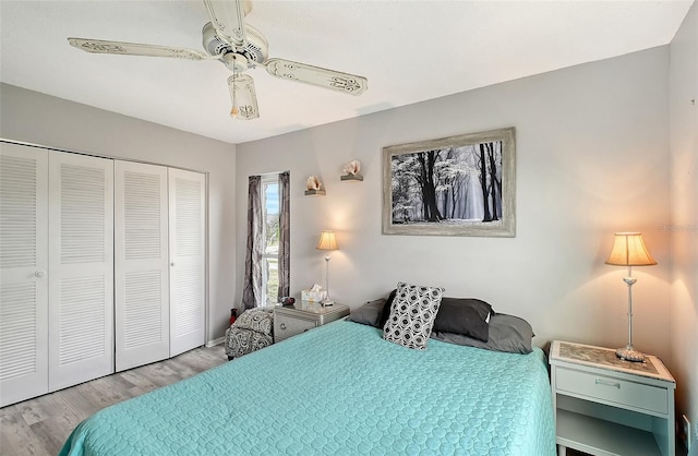 bedroom with ceiling fan, a closet, and light wood-type flooring