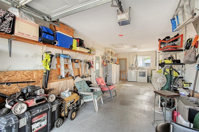 garage with washer and dryer, white fridge, and a garage door opener