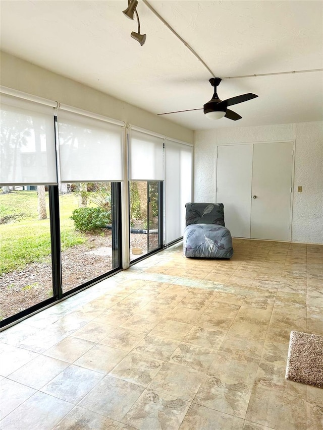 unfurnished room with ceiling fan