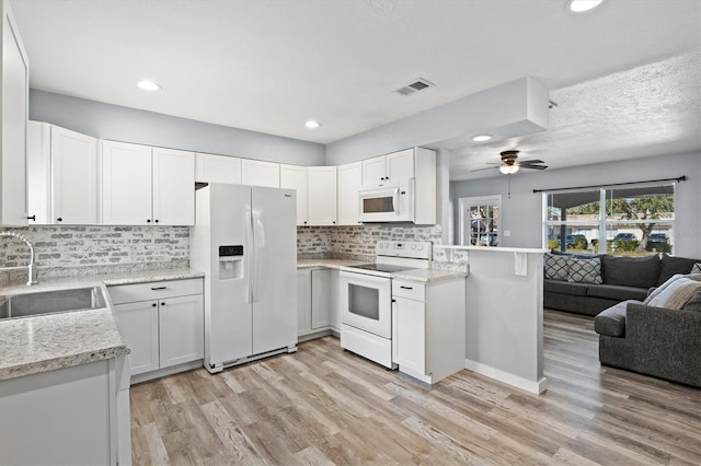 kitchen featuring ceiling fan, sink, light hardwood / wood-style floors, white appliances, and white cabinets