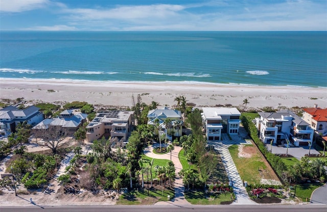 drone / aerial view with a water view and a view of the beach