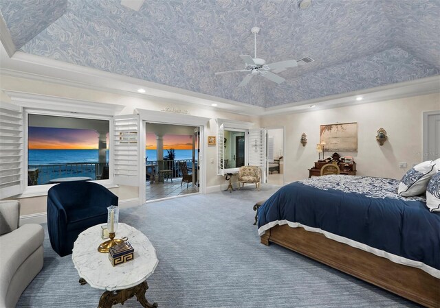 carpeted bedroom with a raised ceiling, a water view, crown molding, ceiling fan, and access to outside