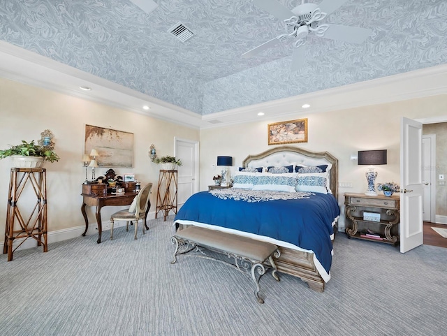 carpeted bedroom with a high ceiling, ornamental molding, and a tray ceiling