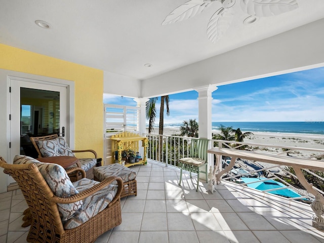 interior space featuring a view of the beach and a water view