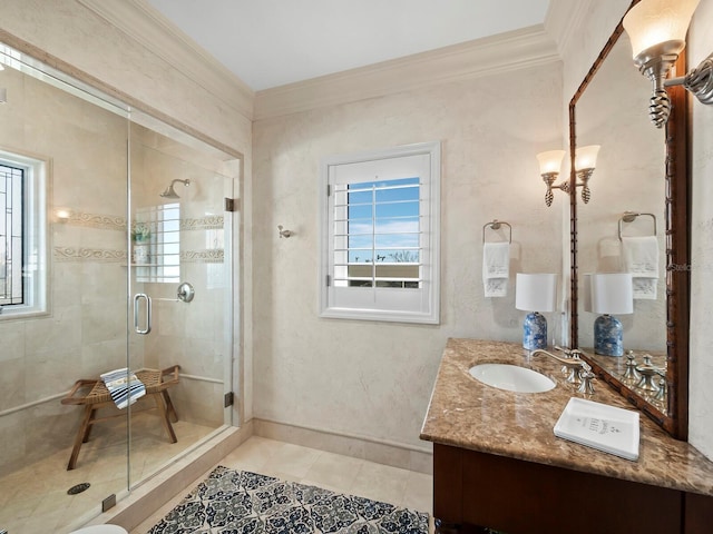 bathroom featuring tile patterned flooring, ornamental molding, a shower with shower door, and vanity