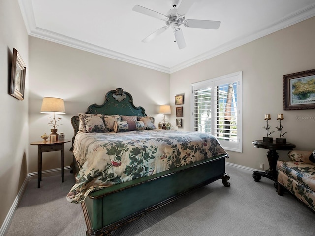 carpeted bedroom featuring baseboards, ornamental molding, and a ceiling fan